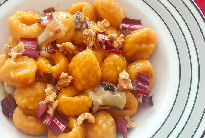 Gnocchi with toma cheese, red chicory and walnuts